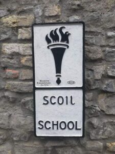 Restored cast-iron Scoil / School sign displayed in the Hands Exhibition at Sligo Folk Park