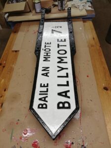 Ballymote / Baile an Mhóte bilingual road sign after restoration at Sligo Folk Park, Riverstown