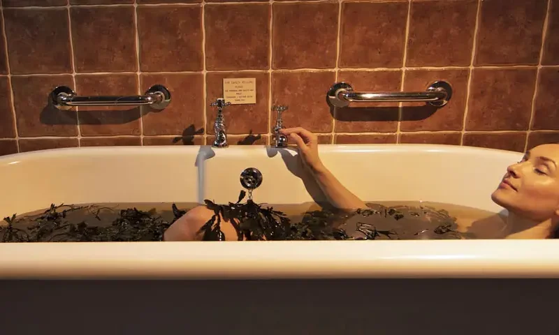 girl sitting in voya seaweed bath